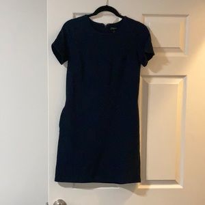 Navy blue shift dress with pockets.